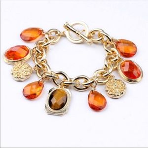 Beautiful orange gems gold charms bracelet!